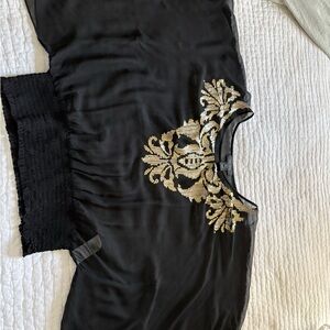 Karen Kane Black Top with Gold and silver sequin embellishments . Large